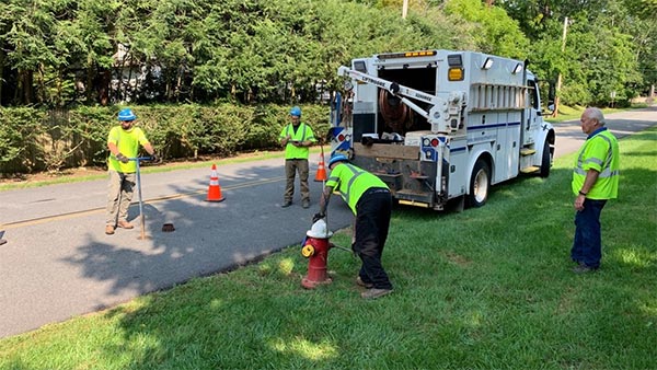 NJAW performing the installation of the Sentryx software enabled Super Centurion hydrant Pressure Monitoring retrofit kit.